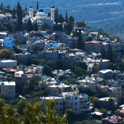1. An awe-inspiring panoramic view of Safed, with its distinctive blue-domed buildings nestled amid verdant hills.